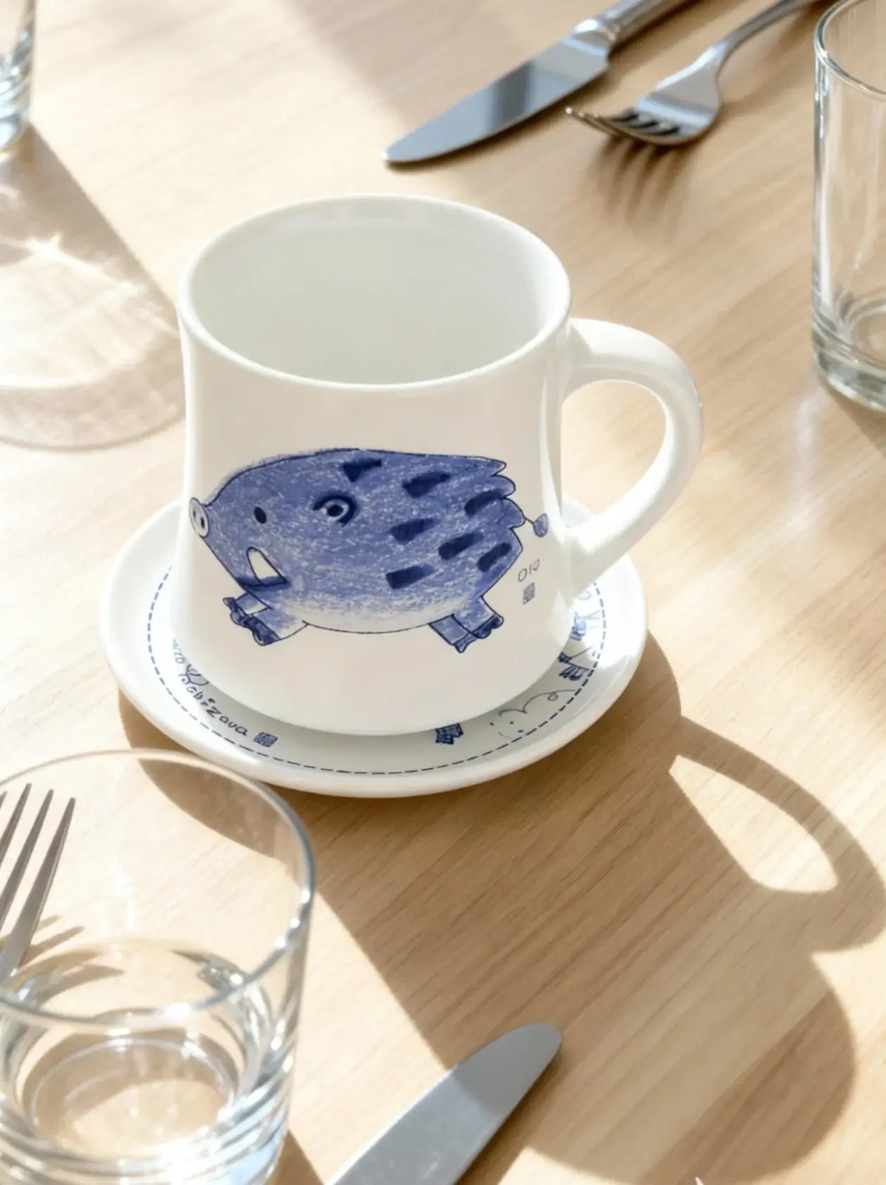 Mavolux handcrafted porcelain mug and plate set featuring a sketched boar illustration. Modern white ceramic cup and saucer with Tokyo-style art, made in Yingge Taiwan.