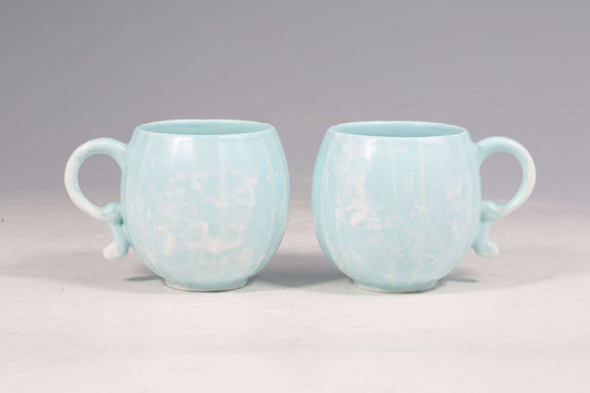 Mavolux handcrafted porcelain mug set in azure blue with a smooth satin-glaze finish. Playful pumpkin-shaped coffee cup made in Yingge Taiwan, creating a cozy and joyful atmosphere.