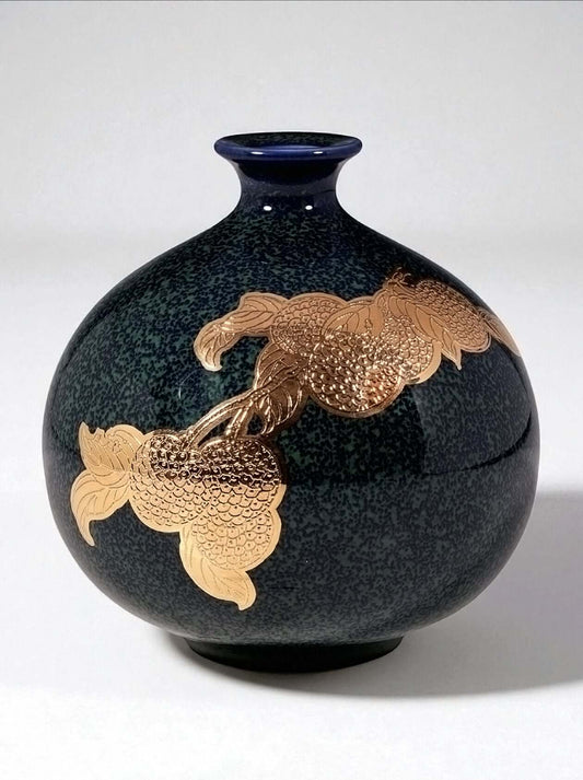 Mavolux handcrafted porcelain sphere vase in deep emerald green with artistic ink-wash glaze and 24K gold gilding. Unique round ceramic centerpiece made in Yingge Taiwan, luxury home decor.