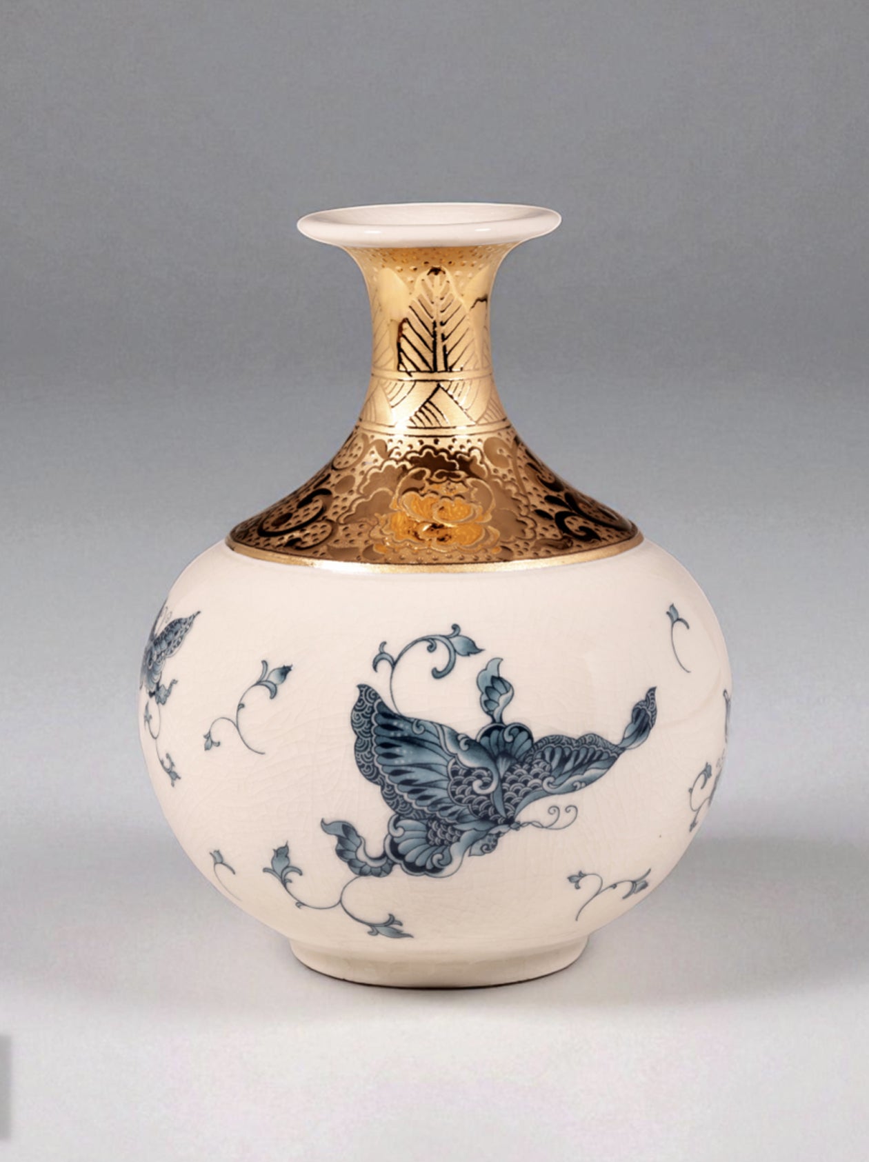 Mavolux handcrafted porcelain vase in ivory-crackle glaze featuring delicate butterfly motifs and German 24K gold accents. Luxury 6-inch ceramic centerpiece made in Yingge Taiwan, symbolizing joy and transformation.
